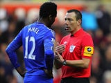 Ref Kevin Friend has a word with Mikel
