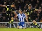 Brighton & Hove Albion's Craig Mackail-Smith is fouled by Leeds United's Jason Pearce and Tom Lees