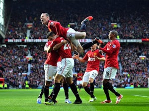 Rooney hails United strikers