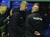 Brian McDermott and Arsene Wenger shake hands at the end of the match