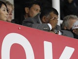 QPR chairman Tony Fernandes hides behind his hands