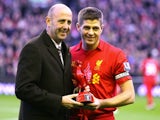 Gary McAllister presents Steven Gerrard with an award for his 600th appearance for Liverpool