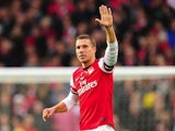 Lukas Podolski celebrates scoring Arsenal's second
