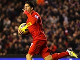Luis Suarez scores the equaliser for Liverpool