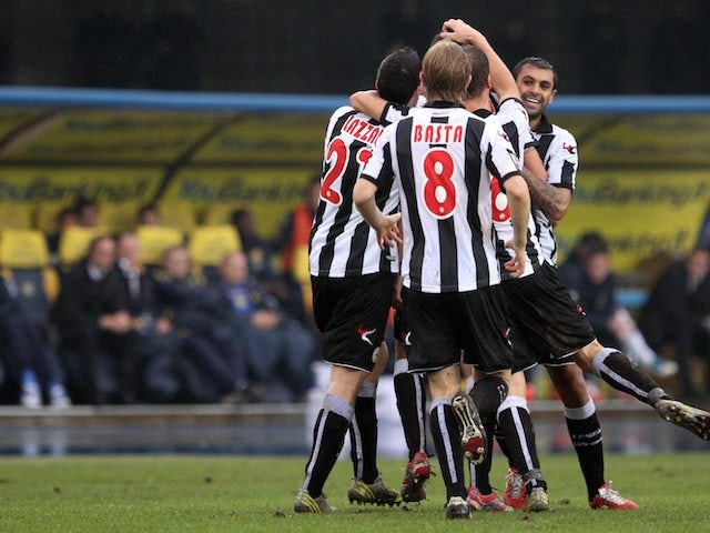 Udinese players celebrate after scoring