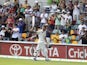 Australia's Ed Cowan leaves the field after being run out for 136