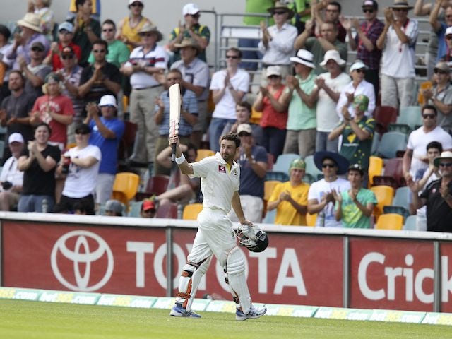 Australia's Ed Cowan leaves the field after being run out for 136