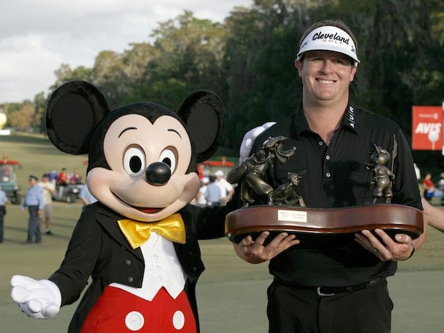 Charlie Beljan celebrates his win with Mickey Mouse