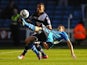 Adam Drury clears the ball away from Liam Feeney on November 18, 2012