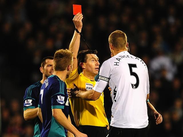 Fulham's Brede Hangeland is shown the red card on November 18, 2012