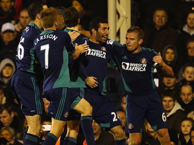 Carlos Cuellar celebrates with Sunderland teammates after scoring on November 18, 2012