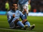 Carlos Tevez celebrating from the ground after scoring on November 17, 2012
