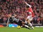 Clint Dempsey is taken down by Laurent Koscielny on November 17, 2012