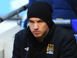 City's super sub Edin Dzeko sitting on the bench on November 17, 2012