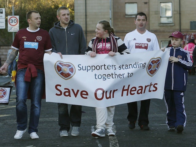 Hearts fans try to raise money for the club before their game with St Mirren November 17, 2012