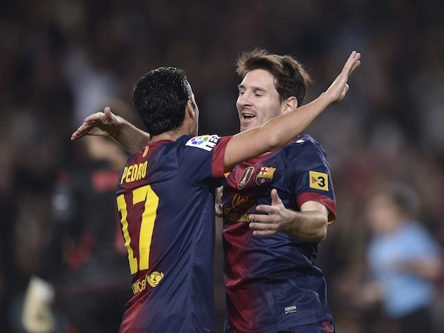 Lionel Messi celebrates after scoring against Zaragoza on November 17, 2012