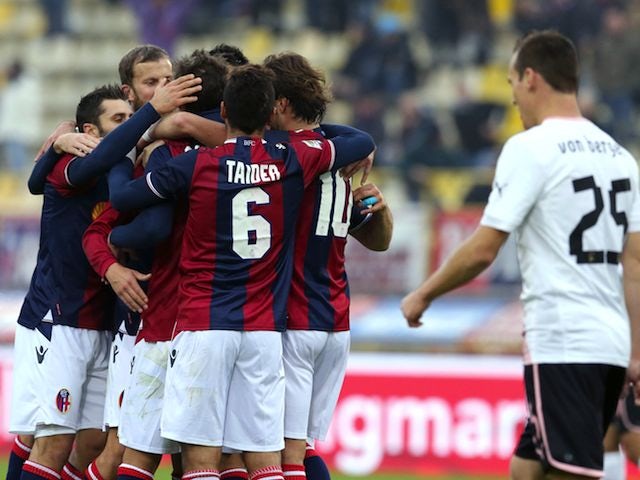 Manolo Gabbiadini celebrates with Bologna teammates after scoring on November 18, 2012