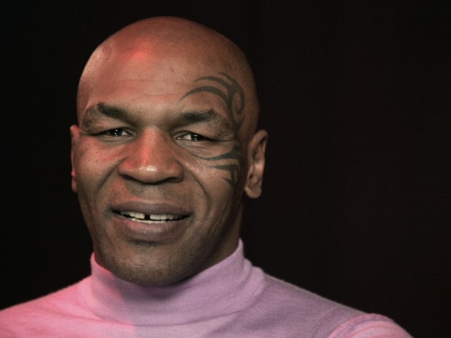 Tyson jokes about tattoo removal