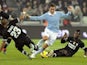 Lazio's Miroslav Klose gets caught in a tangle on November 17, 2012