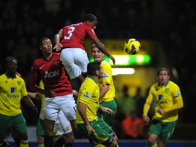 Patrice Evra has a headed attempt at goal on November 17, 2012
