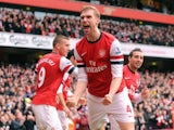 Per Mertesacker celebrates scoring Arsenal's first on November 17, 2012