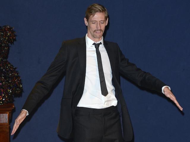 Peter Crouch sports a tache and dances on stage at the launch of the Designer Pudsey 2012 Collection