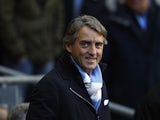 Roberto Mancini smiling before kickoff on November 17, 2012