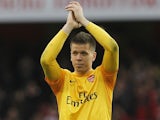 Arsenal keeper Wojciech Szczesny applauds at the end of their win over Spurs on November 18, 2012