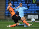 Coventry City's David McGoldrick and Portsmouth's L'ubomir Michalik battle for the ball on November 24, 2012