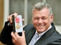 Darren Clarke receives an OBE for services to golf on November 21, 2012