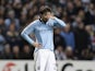 An upset David Silva holds his hand to his face after the final whistle on November 21, 2012