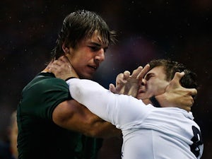 South Africa's Eben Etzebeth and England's Ben Youngs grapple off the ball on November 24, 2012