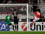 Benfica's Ezequiel Garay scores his side's second against Celtic on November 20, 2012
