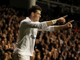 Gareth Bale celebrates moments after scoring his team's second goal on November 25, 2012