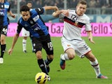 Genoa's Juraj Kucka and Atalanta's Giacomo Bonaventura battle for the ball on November 25, 2012