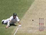 South Africa's Graeme Smith dives to avoid being run out on November 23, 2012