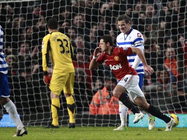 Striker Javier Hernandez scores his team's third goal versus QPR on November 24, 2012