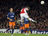 Laurent Koscielny takes a header which hits the crossbar on November 21, 2012