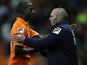Blackpool boss Michael Appleton shakes the hand of goalscorer Isaiah Osbourne on November 24, 2012