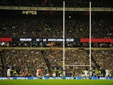 England's Owen Farrell kicks a penalty during the final stages of the match against South Africa on November 24, 2012