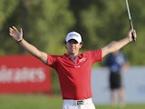 Rory McIlroy celebrates moments after finishing his final shot to win the World Tour Championship in Dubai on November 25, 2012