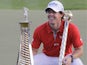 Rory McIlroy with the trophy after winning the final round in the World Tour Championship in Dubai on November 25, 2012