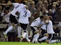 Valencia's Sofiane Feghouli is mobbed by team-mates after his goal against Bayern on November 20, 2012