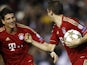Thomas Muller and Mario Gomez celebrate Bayern's equaliser on November 20, 2012
