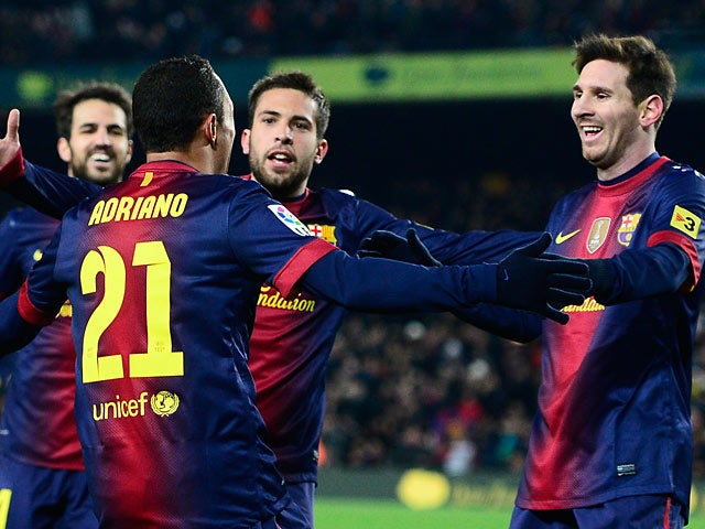 Adriano is congratulated by his team mates after scoring his team's third goal on December 1, 2012
