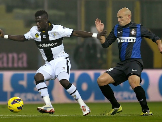 Parma's Afriye Acquah and Inter's Esteban Cambiasso fight for possession on November 26, 2012