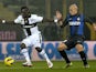 Parma's Afriye Acquah and Inter's Esteban Cambiasso fight for possession on November 26, 2012