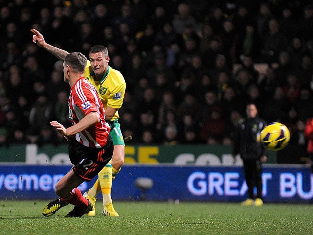 Norwich City's Anthony Pilkington strikes to score his team's second goal on December 2, 2012