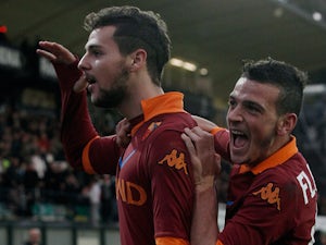 Extra-time strike fires Roma into semi-finals