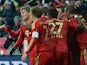 Toni Kroos is congratulated by team mates moments after scoring on December 1, 2012